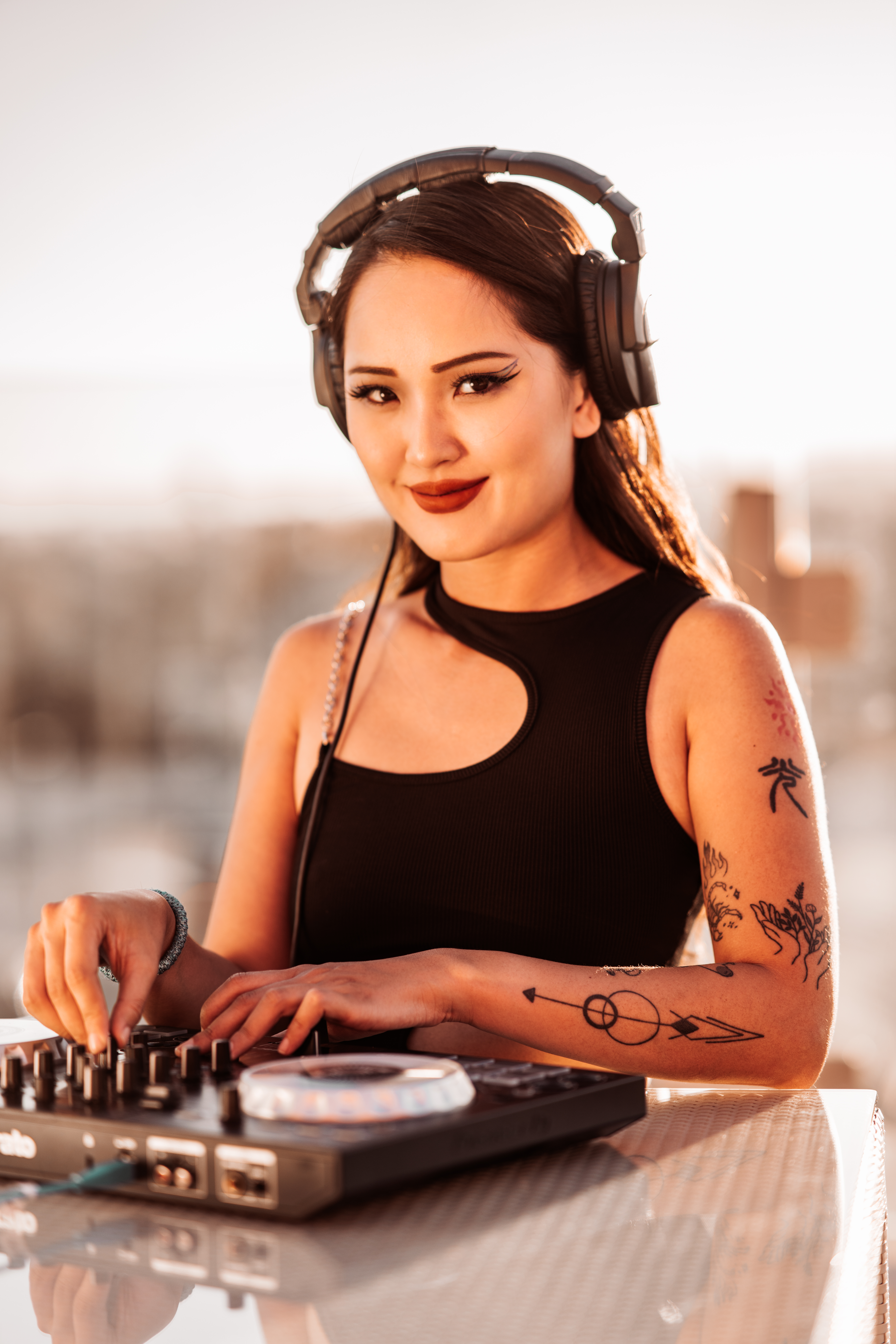 headshot of associate dj, DJ Mish