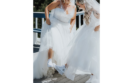 two brides admiring their white chuck taylors