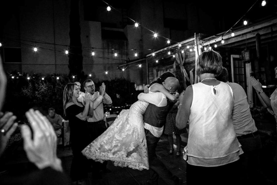 Wedding couple hugging on dance floor