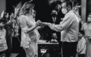 Wedding couple exchanging rings wearing masks