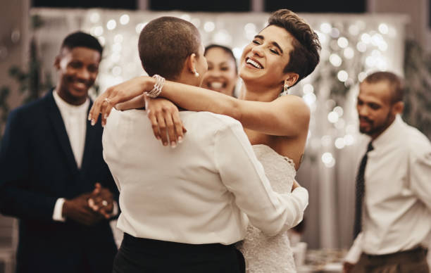 two brides dance and hold each other