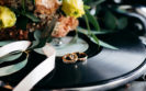 flowers, wedding rings and vinyls