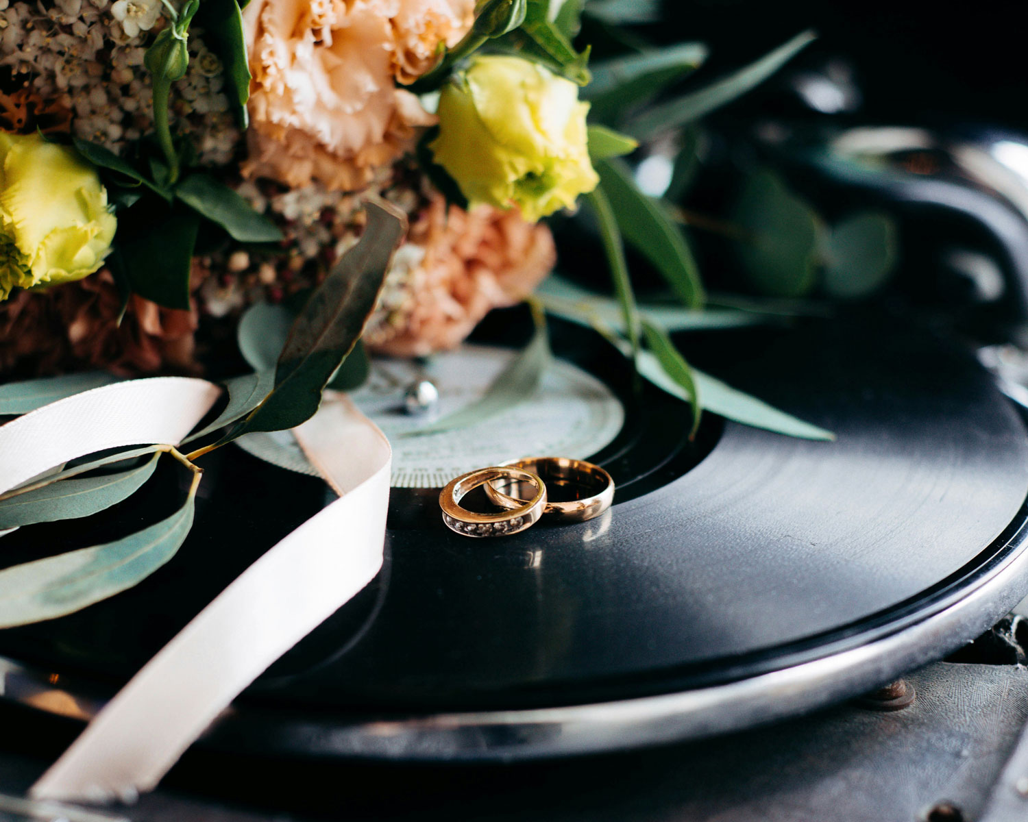 flowers, wedding rings and vinyls