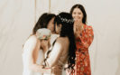 two brides kissing after getting married