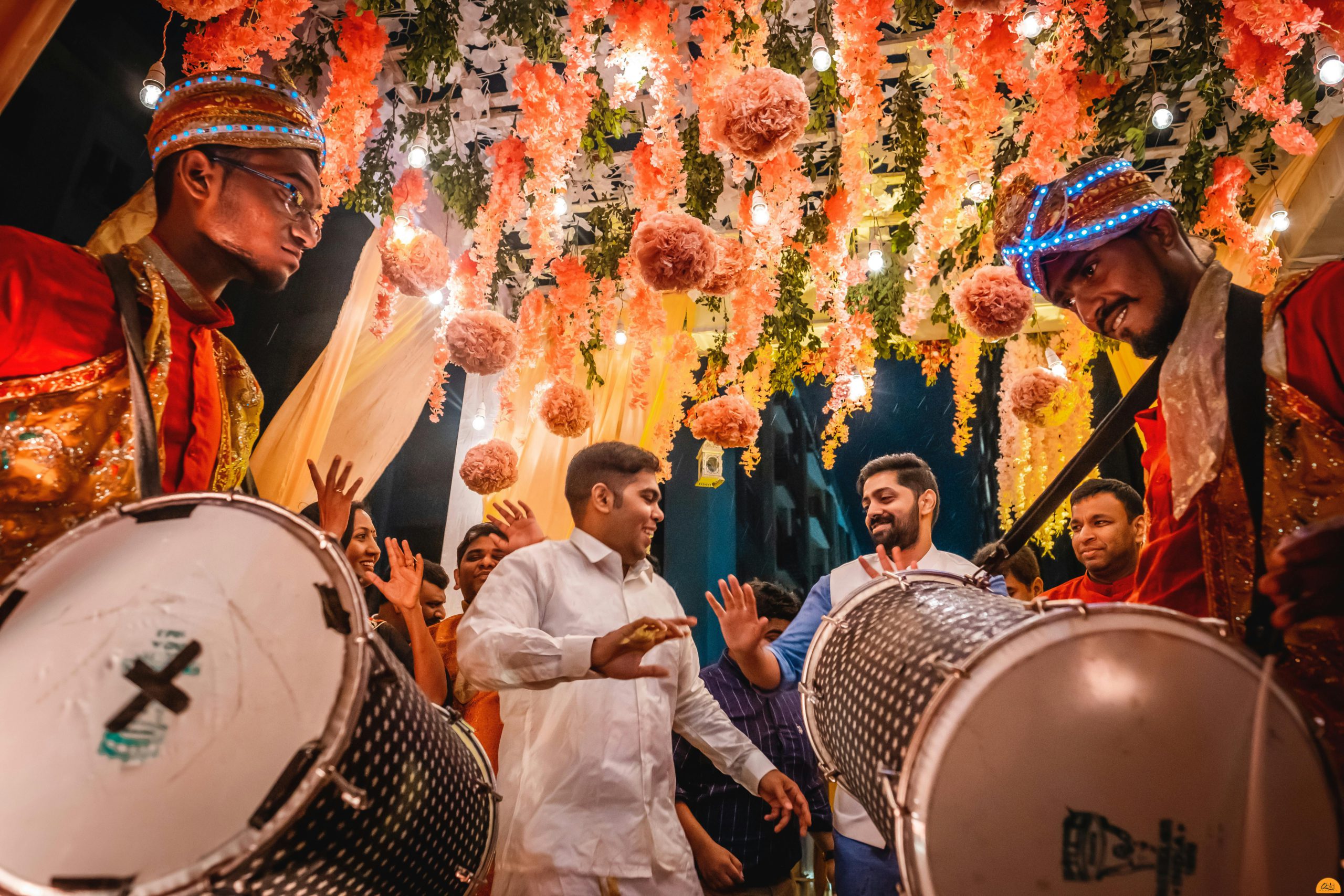 men celebrating at indian wedding