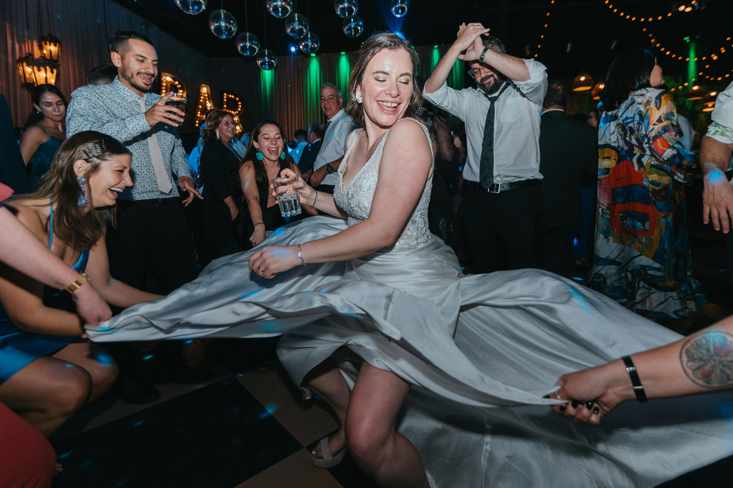 woman dancing with all her wedding guests