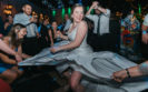 woman dancing with all her wedding guests