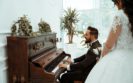 groom playing the piano