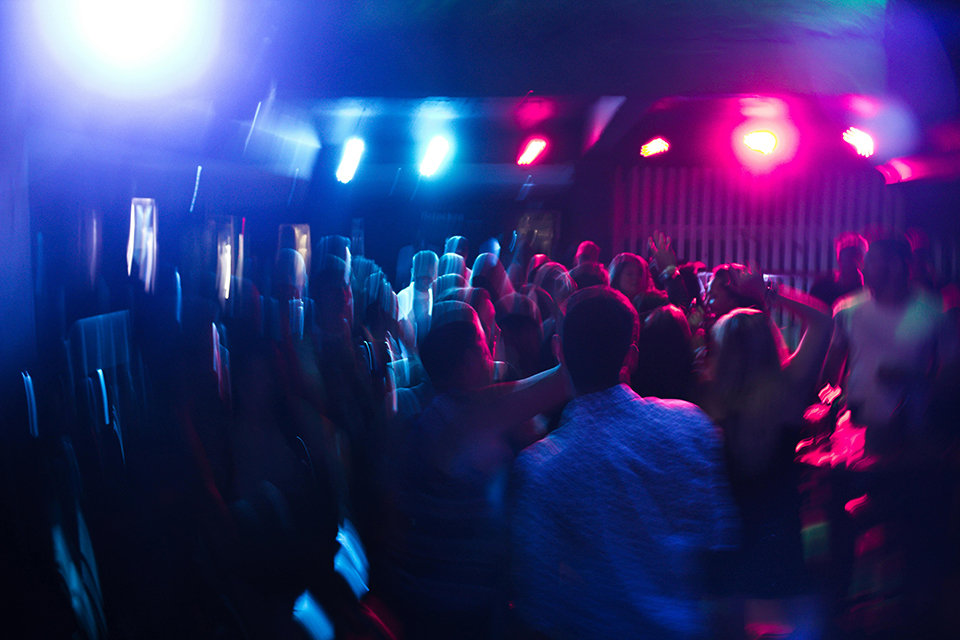 Packed dance floor at a Los Angeles event with DJ Keelez & Associates, featuring vibrant lighting and an energetic crowd enjoying the music.